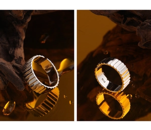 Macro detail of S925 sterling silver ring showing hallmark and vertical pleated texture