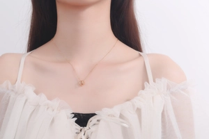 Close-up of elegant rose gold S925 sterling silver interlocking double circle pendant