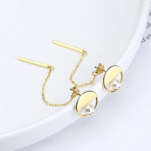Macro detail of S925 hallmark on gold plated crescent moon earrings with pearls