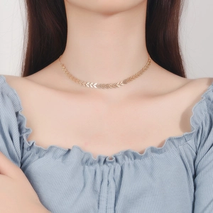 Elegant gold leaf choker necklace in S925 sterling silver worn by a model for daily style