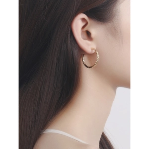 Minimalist gold hammer-textured hoop earrings with a chic crushed foil aesthetic for women