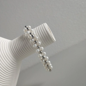 Handcrafted silver bead and pearl layered bracelet in a minimalist woven design