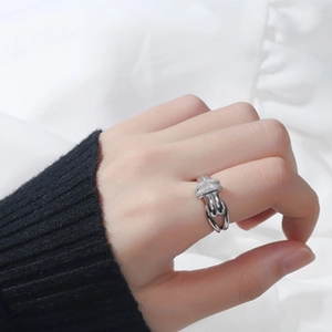 Detail of S925 sterling silver ring with pavé cubic zirconia on a model's finger