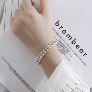 Elegant double-layer hand-woven bracelet with white pearls and silver metal round beads