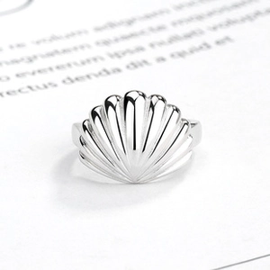 Macro detail of high-polished S925 sterling silver shell-shaped open ring for women