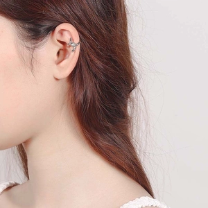 S925 sterling silver twist cuff earring shown on model in a minimalist style