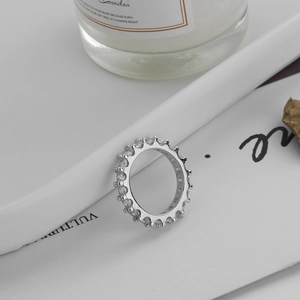 Detailed view of silver S925 sterling silver eternity ring with zircon stones in tray
