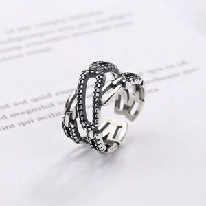 Detail of s925 silver ring featuring vintage hollow oval links and oxidized finish