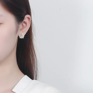 Elegant 925 silver stud earrings with cluster of white pearls in a floral pattern