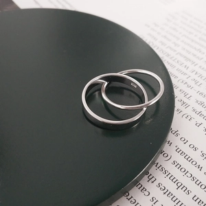 Macro shot of S925 sterling silver double-ring set showing hallmark engraving