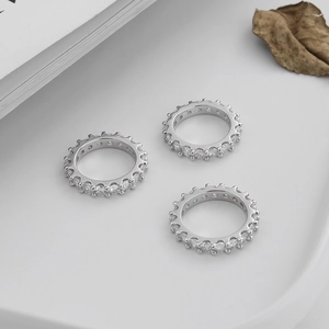 Macro shot of three S925 sterling silver gear rings with full zircon eternity band design