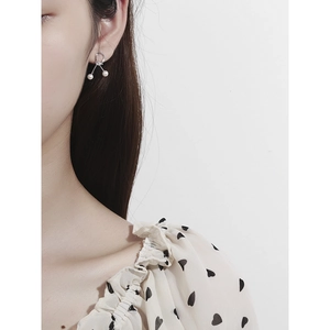 Elegant S925 sterling silver knot earrings featuring lustrous white pearls for women