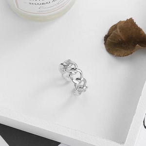 Detailed macro view of S925 silver ring featuring a hollow Cuban chain link design