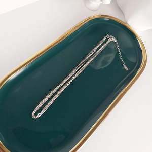 Detail view of S925 sterling silver double-layer chain with lobster clasp and extension