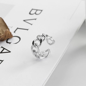 Macro detail of silver twisted chain ring with polished finish and open adjustable design