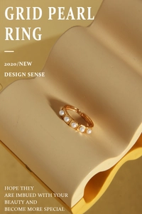 Close-up of a gold-plated grid ring with five elegant white pearls in a minimalist design