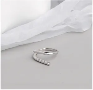 Macro detail of S925 sterling silver ring featuring a minimalist spiral line design