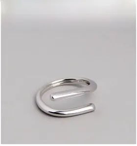 Macro shot showing the S925 hallmark on minimalist silver twisted geometric ring