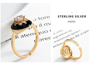 Macro detail of S925 sterling silver ring with black enamel flower and adjustable band