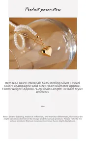 Macro shot of S925 silver heart necklace with champagne gold finish and shell pearl