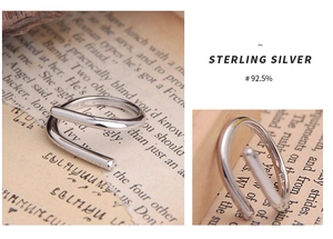 Detail of S925 sterling silver ring showing polished spiral design and hallmark engraving