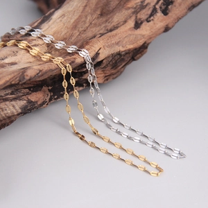 Macro detail of minimalist S925 sterling silver chain necklaces in gold and silver finish