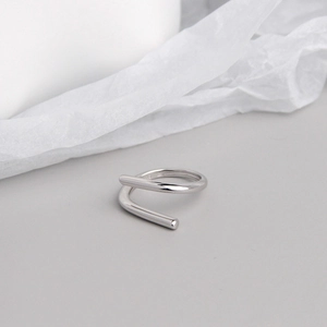 Macro detail of minimalist S925 sterling silver ring showing double-layer sleek lines