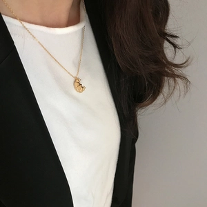 Elegant 925 sterling silver gold-plated croissant moon necklace on female collarbone