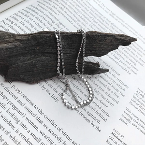 Detail of minimalist S925 sterling silver double layer bracelet with flat round beads