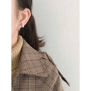 Minimalist S925 sterling silver twist earrings with zircon set on a model