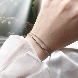 Elegant S925 sterling silver double-layer bracelet with flat beads on a female wrist