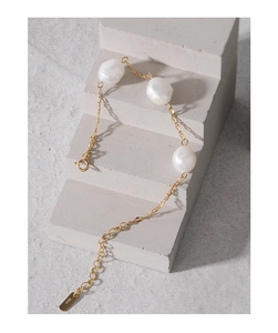 Macro detail of three baroque pearls on S925 silver chain with adjustable spring clasp