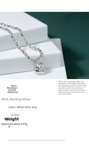 Macro shot of S925 sterling silver heart bracelet with white gold finish and bead chain