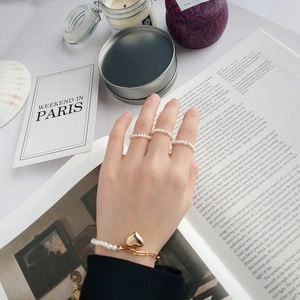 Elegant S925 silver pearl bracelet and rings set featuring a gold heart pendant charm