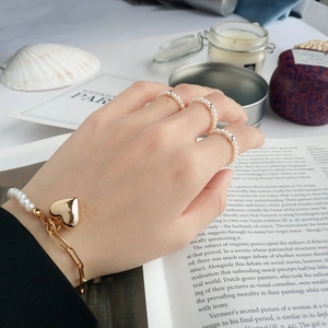 Minimalist S925 silver pearl bracelet with gold heart charm and matching rings