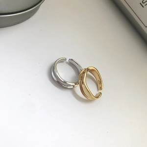 Detailed close-up of S925 sterling silver minimalist layered open rings with hallmark