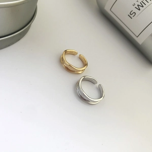 Detailed view of S925 sterling silver minimalist geometric rings in gold and silver