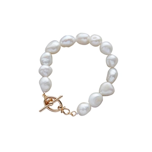 Elegant 925 sterling silver baroque pearl bracelet with a golden toggle clasp on white background