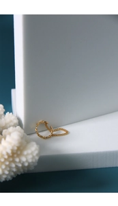Detail of minimalist gold chain ring featuring an asymmetric open adjustable design