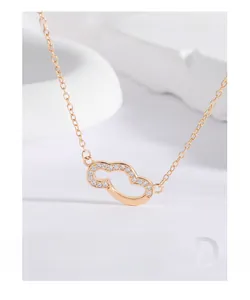 Detailed close-up of rose gold cloud pendant with sparkling pavé zircons on S925 silver chain