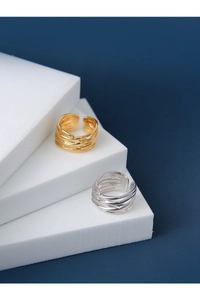 Macro shot of S925 sterling silver stamp on multilayer gold and silver woven rings