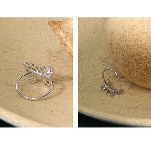 Detail of S925 sterling silver butterfly ring with hollow design and open adjustable band