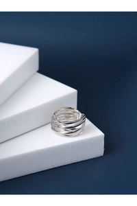 Detailed view of S925 sterling silver multi-layer layered crossover ring on white stand