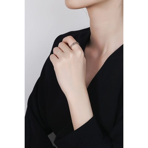 Minimalist S925 sterling silver multi-layer stacked rings on woman hand with black V-neck