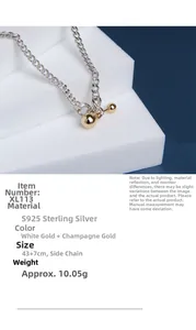 Detail view of S925 sterling silver chain with bicolor spherical pendant and specs