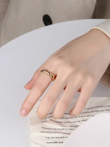 Detailed macro shot of a gold bamboo-style S925 silver ring featuring organic lava texture