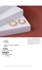Macro detail of ES112 S925 sterling silver hoop earrings with champagne gold and small pearls