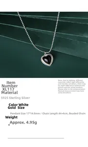 Macro view of S925 sterling silver heart pendant with black onyx inlay and beaded edge