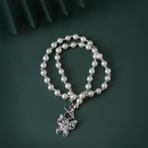 Elegant S925 sterling silver pearl necklace with zircon butterfly pendant and toggle clasp