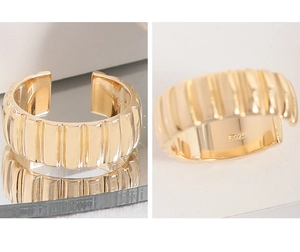 Detail view of gold S925 gear texture ring showing internal material hallmark stamp